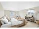 Cozy bedroom featuring lots of natural light, wood-like floors, and comfortable modern furnishings at 5549 Hollister Dr, Indianapolis, IN 46224