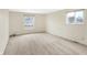 Spacious carpeted bedroom with two windows providing plenty of natural light at 5549 Hollister Dr, Indianapolis, IN 46224