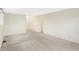 Carpeted bedroom with neutral walls and a door leading to another room at 5549 Hollister Dr, Indianapolis, IN 46224