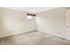 Bedroom with a window and a closet with bi-fold doors at 5549 Hollister Dr, Indianapolis, IN 46224