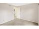 Neutral carpeted bedroom with a door leading to another room at 5549 Hollister Dr, Indianapolis, IN 46224