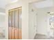 Bright hallway with wood closet doors, fresh paint, and carpet floors throughout at 5549 Hollister Dr, Indianapolis, IN 46224
