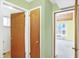 Open hallway provides access to rooms and features hardwood doors and trim at 5549 Hollister Dr, Indianapolis, IN 46224