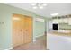 Open-concept kitchen with tile flooring, updated appliances, and eat-in breakfast bar at 5549 Hollister Dr, Indianapolis, IN 46224