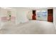 Bright living room with hardwood built-ins, carpet flooring, and ample natural light at 5549 Hollister Dr, Indianapolis, IN 46224