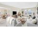 Inviting living room with lots of natural light and open floor plan to dining room, ideal for entertaining at 5549 Hollister Dr, Indianapolis, IN 46224
