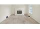 Cozy living room featuring a white fireplace, new carpet, and a window at 5549 Hollister Dr, Indianapolis, IN 46224