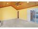 Sun room features a wood-planked ceiling, and a sliding glass door to an outdoor deck at 5549 Hollister Dr, Indianapolis, IN 46224
