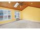 Sun room features a wood-planked ceiling, ceiling fan and multiple windows for ample light at 5549 Hollister Dr, Indianapolis, IN 46224