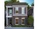 Charming two-story home with gray siding, stone accents, gray shutters, and a small front porch at 555 Gilder Dr, Carmel, IN 46032