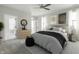 Stylishly decorated main bedroom with a comfortable bed, dresser, and an open door to a private balcony at 555 Gilder Dr, Carmel, IN 46032