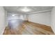 Spacious basement featuring new wood-look vinyl floors, recessed lighting, and paneled walls at 6608 Rushing, Noblesville, IN 46062