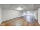Open basement area with wood-look vinyl floors, recessed lighting, and bright white walls at 6608 Rushing, Noblesville, IN 46062