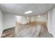 Large finished basement with modern flooring, bright lighting, and plenty of open space at 6608 Rushing, Noblesville, IN 46062