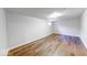 Basement room featuring new wood-look vinyl floors, recessed lighting, and bright white walls at 6608 Rushing, Noblesville, IN 46062