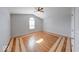 Bedroom with parquet hardwood flooring, vaulted ceiling, arched window and ceiling fan at 6608 Rushing, Noblesville, IN 46062