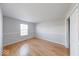 This bedroom offers hardwood floors and a window letting in light for a cozy space at 6608 Rushing, Noblesville, IN 46062