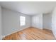 This bedroom offers hardwood floors, a window letting in light and closet space for storage at 6608 Rushing, Noblesville, IN 46062