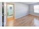 This bedroom provides hardwood floors, a window, and leads to the light blue colored bathroom at 6608 Rushing, Noblesville, IN 46062