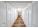 Hallway with new wood-look vinyl floors, bright lighting, and closet space at 6608 Rushing, Noblesville, IN 46062