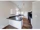 Modern kitchen featuring white cabinets, black appliances, and sleek countertops at 6608 Rushing, Noblesville, IN 46062