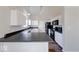 Bright kitchen featuring white cabinets, sleek black countertops, and modern appliances at 6608 Rushing, Noblesville, IN 46062