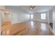 Spacious living room with vaulted ceiling and gleaming hardwood floors and abundant natural light at 6608 Rushing, Noblesville, IN 46062