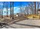 Backyard featuring a shed, wood deck, and pea gravel at 6775 W Woodcrest Dr, Greenfield, IN 46140