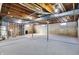 Unfinished basement with exposed beams and utilities awaiting your design at 6775 W Woodcrest Dr, Greenfield, IN 46140