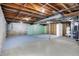 Unfinished basement with exposed beams and utilities awaiting your design at 6775 W Woodcrest Dr, Greenfield, IN 46140