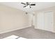 Bedroom with neutral carpet, ceiling fan with lighting, and closet for storage at 6775 W Woodcrest Dr, Greenfield, IN 46140