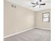 Well-lit bedroom with neutral carpet and fresh paint complemented by a ceiling fan at 6775 W Woodcrest Dr, Greenfield, IN 46140
