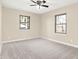 Comfortable bedroom with natural light from two windows and plush carpeting for a cozy atmosphere at 6775 W Woodcrest Dr, Greenfield, IN 46140