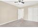 Bright bedroom with closet and ensuite bathroom featuring neutral carpet and modern fixtures at 6775 W Woodcrest Dr, Greenfield, IN 46140