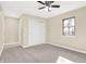 Bedroom with neutral carpet, ceiling fan with lighting, and closet for storage at 6775 W Woodcrest Dr, Greenfield, IN 46140