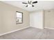 Bright bedroom with closet doors, a ceiling fan, and plush carpeting for a cozy and functional space at 6775 W Woodcrest Dr, Greenfield, IN 46140