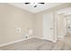 Spacious bedroom featuring an ensuite bathroom, ceiling fan, and wood-look floors for comfort and style at 6775 W Woodcrest Dr, Greenfield, IN 46140