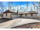 Charming one story home with a brick exterior, attached garage, and a well manicured front yard at 6775 W Woodcrest Dr, Greenfield, IN 46140