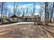 Beautiful one-story home with a brick exterior, attached garage, and a partially wooded front yard at 6775 W Woodcrest Dr, Greenfield, IN 46140