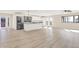 A spacious kitchen boasts a large island, stainless steel appliances, and ample natural light, creating a modern, inviting atmosphere at 6775 W Woodcrest Dr, Greenfield, IN 46140