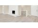Light-filled living area with a modern fireplace, sleek flooring, and minimalist design offers a cozy and inviting atmosphere at 6775 W Woodcrest Dr, Greenfield, IN 46140