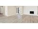 Spacious living room with a fireplace, plenty of natural light, and hardwood floors at 6775 W Woodcrest Dr, Greenfield, IN 46140