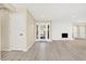 Spacious living room with a fireplace, plenty of natural light, and hardwood floors at 6775 W Woodcrest Dr, Greenfield, IN 46140