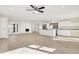 Large living room with a fireplace, an open floor plan, plenty of natural light, and hardwood floors at 6775 W Woodcrest Dr, Greenfield, IN 46140