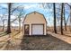 New shed with a door and roll up door for secure storage at 6775 W Woodcrest Dr, Greenfield, IN 46140