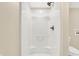 A bright, newly installed shower features a modern shower head and easy to clean walls at 6775 W Woodcrest Dr, Greenfield, IN 46140
