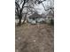 Backyard showing the back of the house with parking at 712 Lynn St, Indianapolis, IN 46222