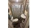 Modest bathroom area with toilet, sink and shower at 712 Lynn St, Indianapolis, IN 46222