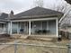Charming home featuring a cozy front porch for relaxing and entertaining outdoors at 712 Lynn St, Indianapolis, IN 46222