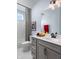 Well-lit bathroom featuring gray cabinets, white countertop and ceramic tile at 746 Astor Dr, Carmel, IN 46032
